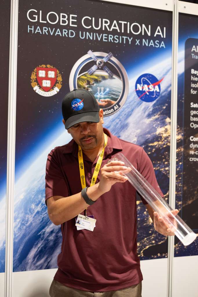 David Rivers demonstrating a water-transparency measurement tube